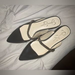 Genuine leather flats with gold chain detail.